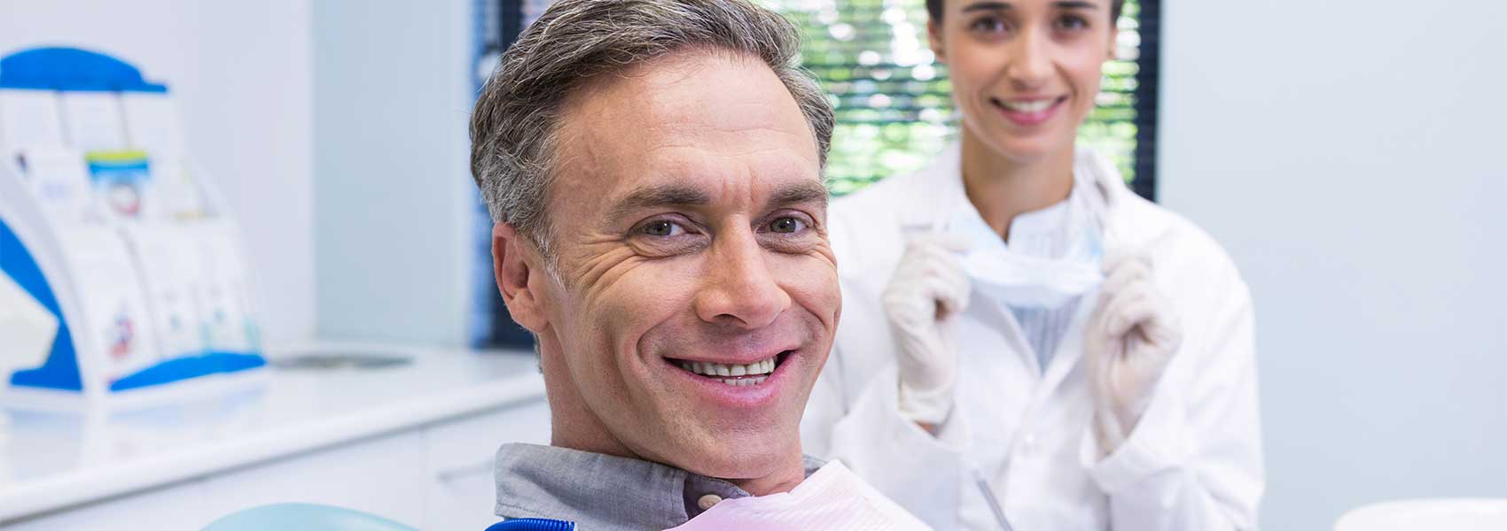 Patient waiting for oral cancer screening at dental