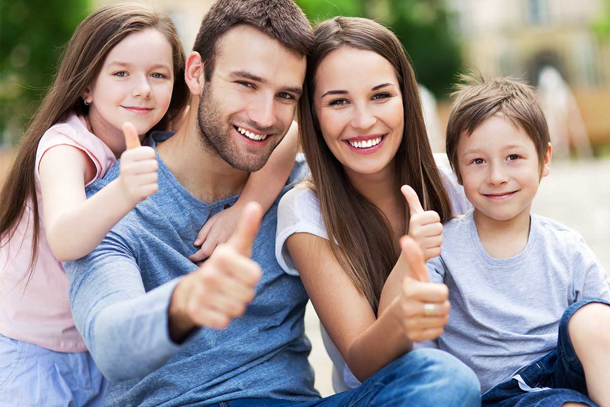 Family portrait with thumbs up