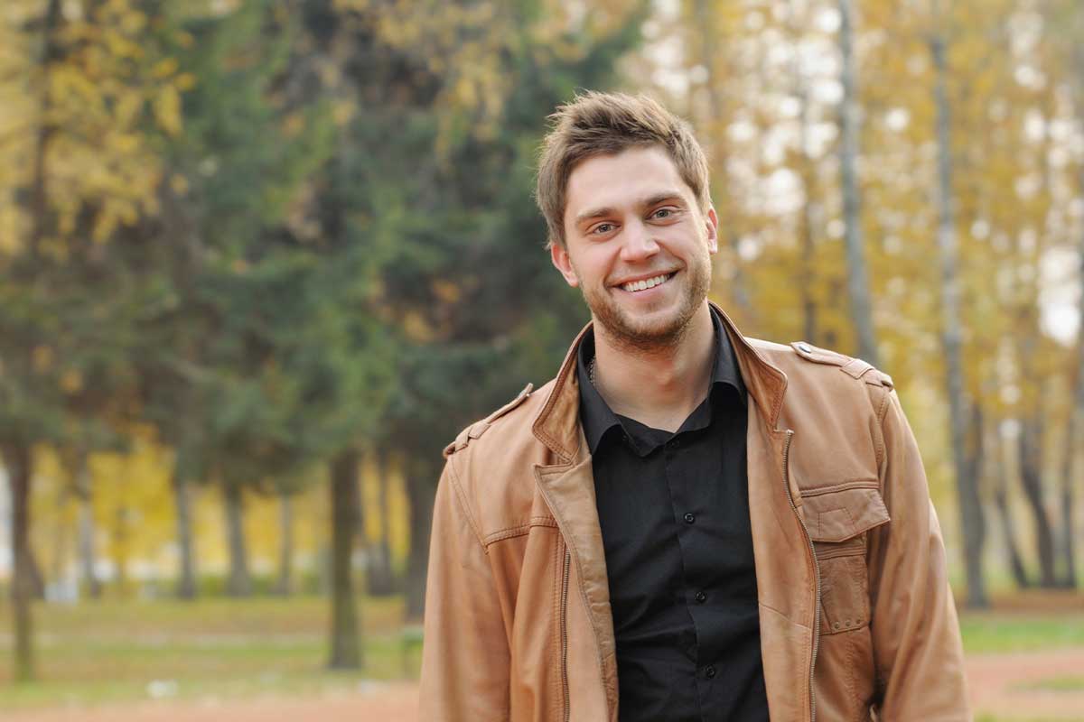Portrait of attractive happy smiling stylish young man