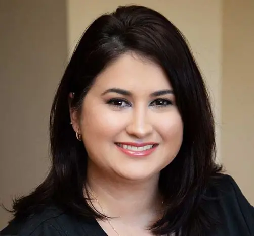 Erica, dental coordinator at Orlando dental practice on Mills Ave, smiling professionally.