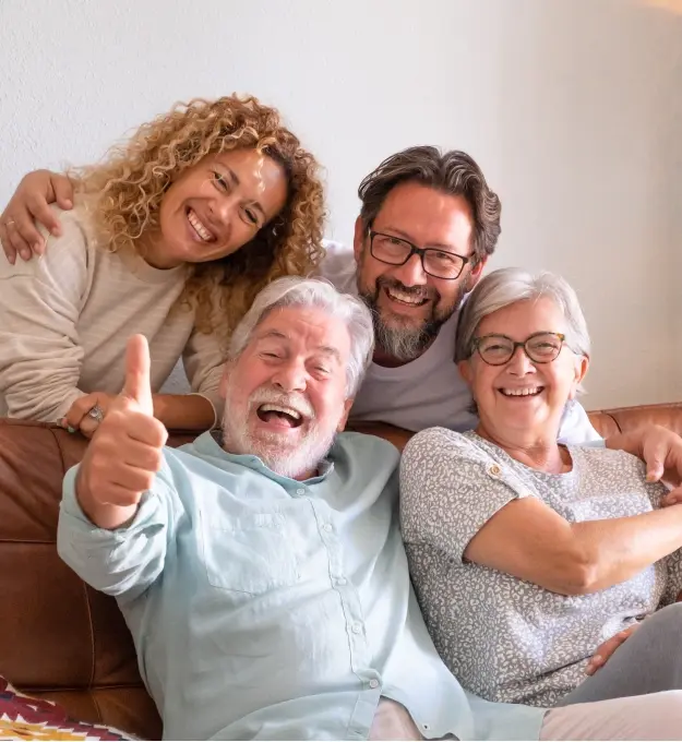 Happy multi-generational family smiling together at Orlando dental practice.