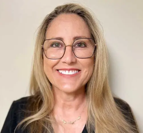 Pam, dental hygienist at 430 N Mills Ave, Orlando, FL, smiling for professional headshot.