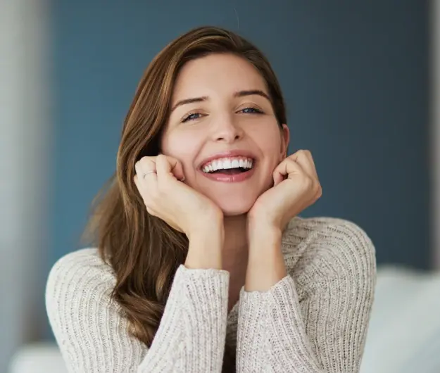 Happy woman with a bright, confident smile showcasing cosmetic dental results in Orlando.