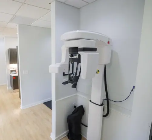 Cone beam 3D CT scanner in modern dental treatment room at Orlando practice.