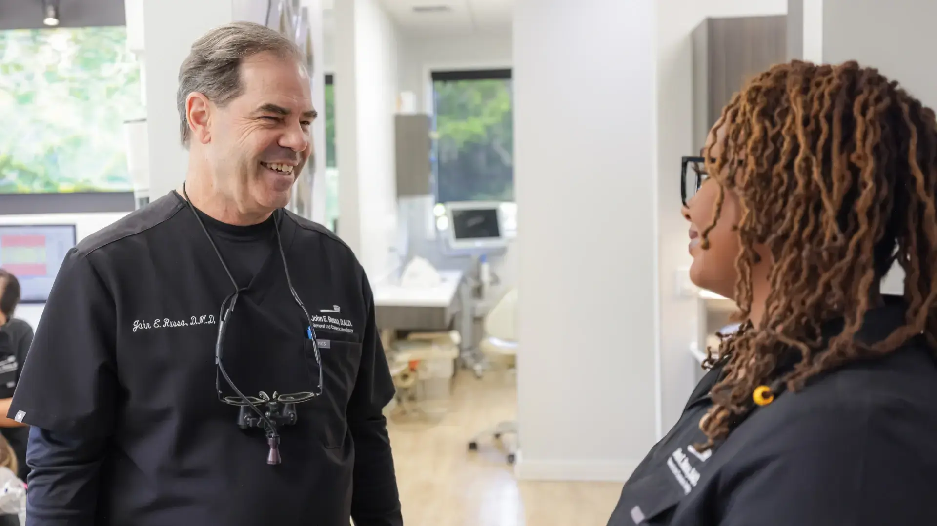 Patient reclining comfortably in a dental chair during a visit at John E. Russo DMD