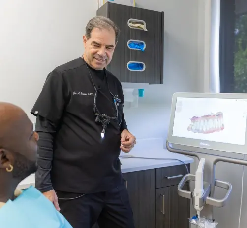Dentist demonstrating Tero Digital Impression System to patient in Orlando dental office.