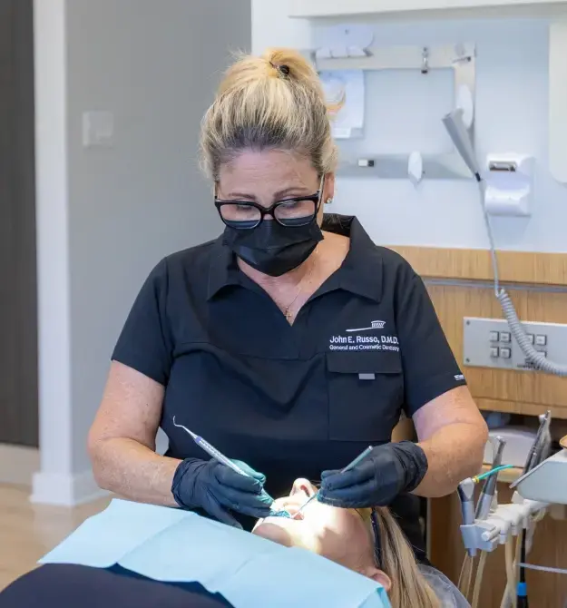 Dr. Russo performing restorative dental treatment on a patient in Orlando dental office.